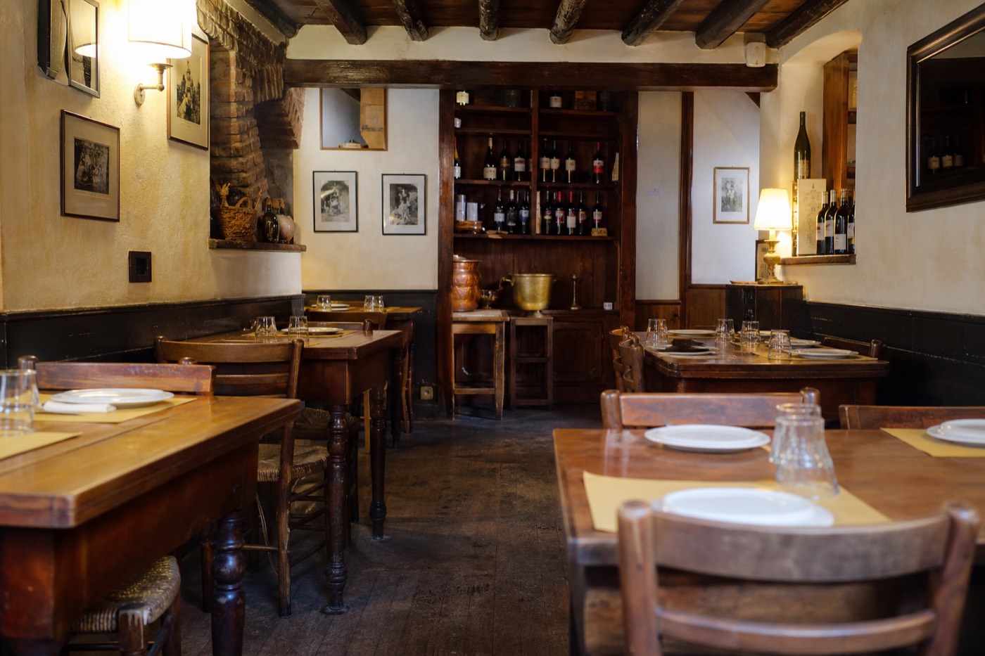 Covered market stall with cured meats and cheeses, a stop for the best restaurants in Parma