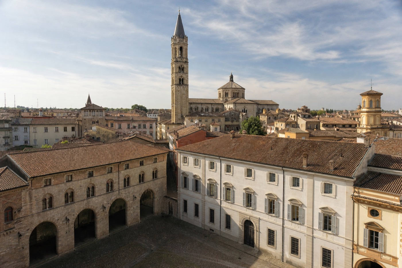 Parma Cathedral's Romanesque facade and bell tower across Piazza Duomo, one of the top things to do in Parma Italy